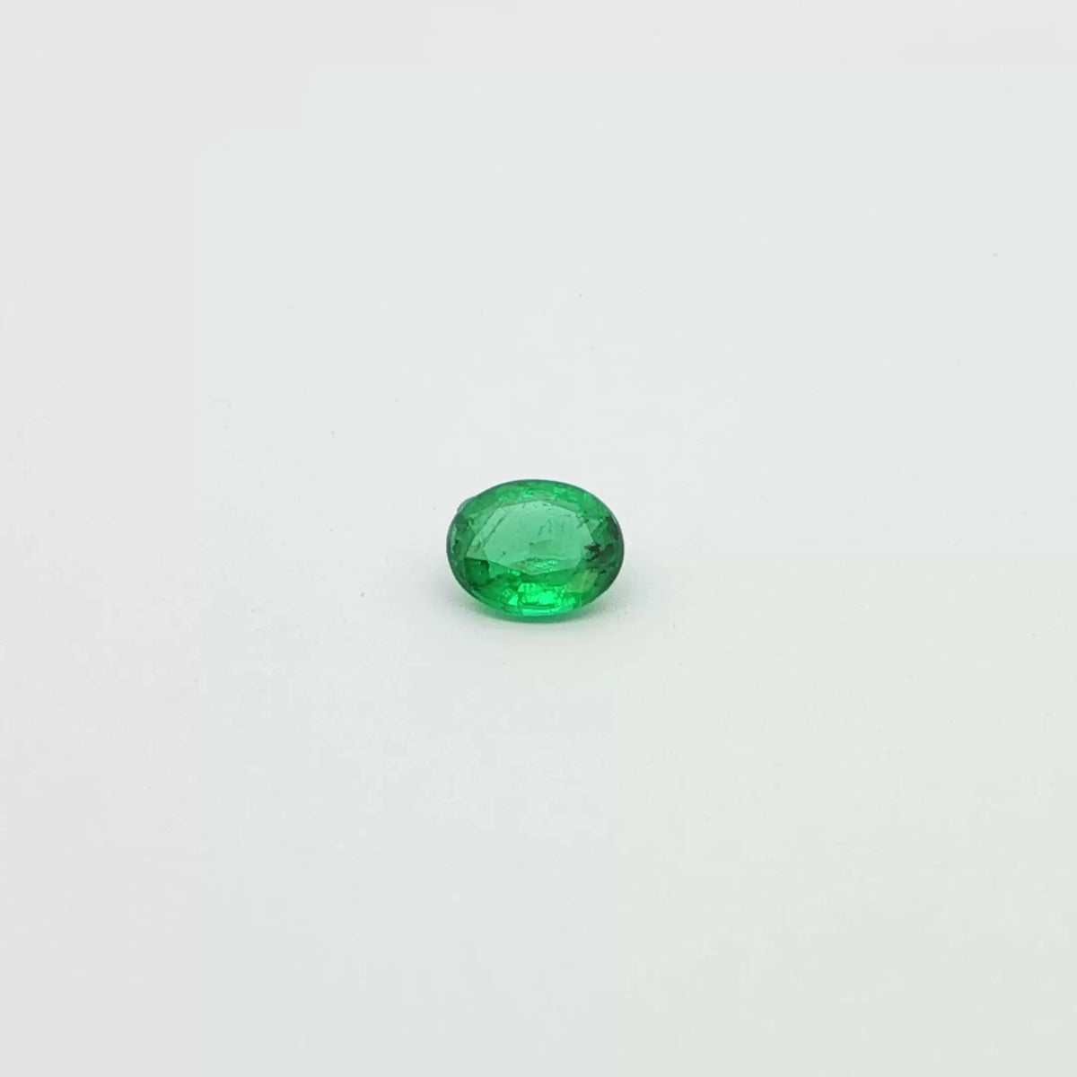 0.54ct Oval Natural Emerald (Colour Green, Clarity Slightly Included, Cut Faceted)